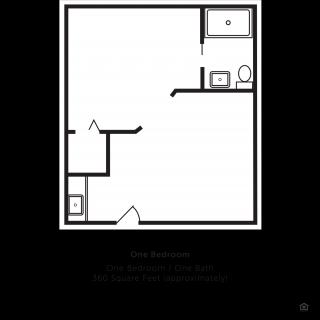 A minimalist floor plan of a bathroom with essential fixtures.