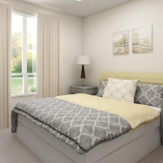 A modern and minimalist bedroom with soft lighting and neutral decor.