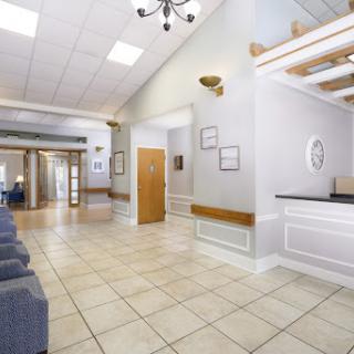 A spacious and inviting reception area featuring modern decor and ample seating.
