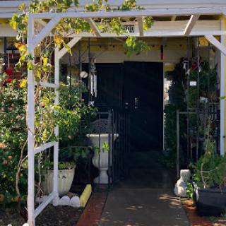A welcoming entrance adorned with greenery.