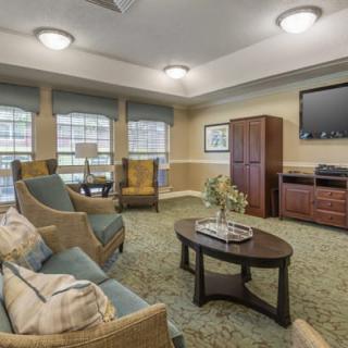 A cozy living room with comfortable seating and a television setup.