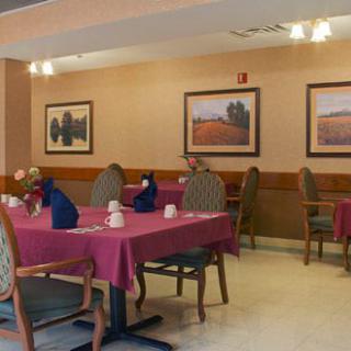 A cozy restaurant dining area with tables set for guests.