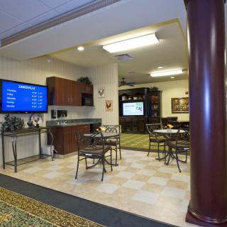 A comfortable waiting area with seating and television.
