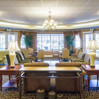 A spacious and elegantly designed lobby with comfortable seating and warm lighting.