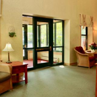 A cozy lobby area with comfortable seating and decor near an entrance.