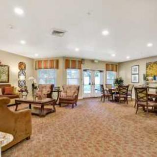 A cozy living room with comfortable seating and warm lighting.