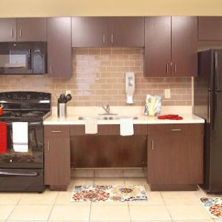 A modern kitchen featuring sleek appliances and a functional layout.