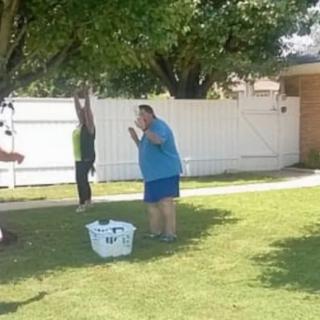 People enjoying a sunny day in the yard.