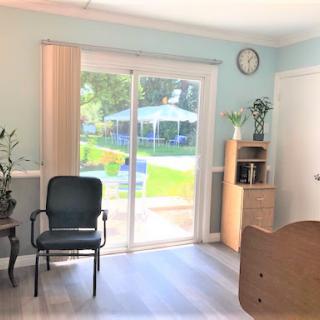 A bright and inviting living space with a sliding door leading to an outdoor area.
