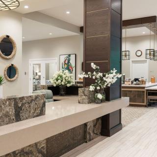 A modern lobby area with stylish decor and lighting.