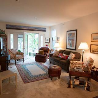 Cozy living room with comfortable seating and natural light.