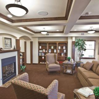 Cozy living room with comfortable seating and a fireplace.