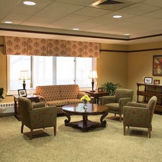 A cozy living room with comfortable seating and warm lighting.