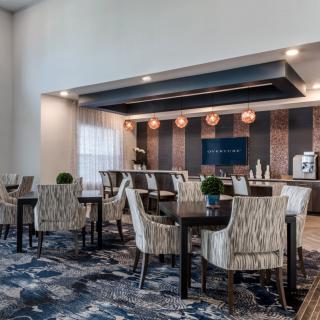 A modern hotel lobby with comfortable seating and stylish decor.