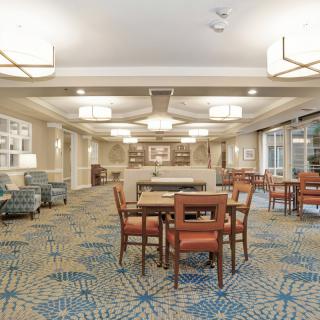 A well-lit hotel lobby featuring comfortable seating and modern decor.