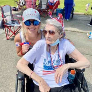 A joyful moment shared between generations during a patriotic celebration.