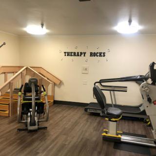 A well-equipped therapy gym designed for rehabilitation and fitness.