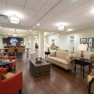 A spacious and elegantly designed lounge area with comfortable seating and stylish decor.