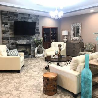 A modern living room with cozy seating and elegant decor.