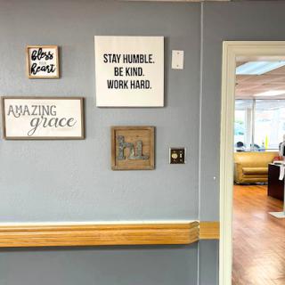 A glimpse of motivational wall art in an office setting, encouraging a positive work environment.