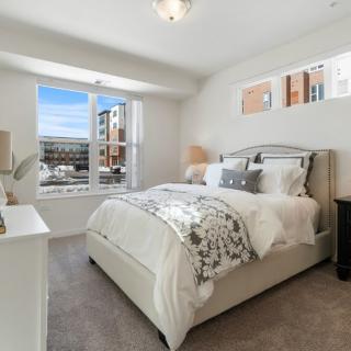 A cozy bedroom with natural lighting and stylish decor.