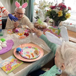 A joyful Easter celebration with seniors, complete with festive decorations and a colorful spread.