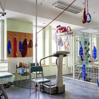 A rehabilitation room equipped with various physical therapy apparatus.
