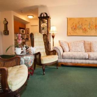 A cozy living room with vintage furniture and decor.