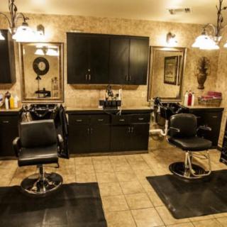 A cozy hair salon interior with styling chairs and mirrors.