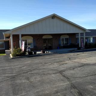 A view of a commercial building with an inviting entrance on a clear day.