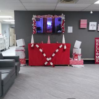 A festive lobby area decorated with red and white elements, creating a warm welcome.