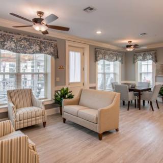 A cozy open-plan living and dining space with comfortable seating and natural light.