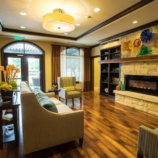 A cozy living room with a warm fireplace and elegant interior design.