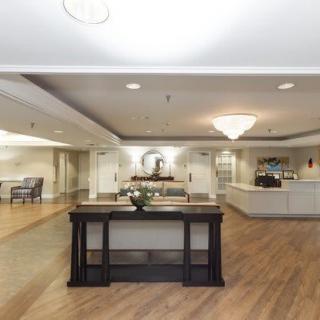 A modern and spacious lobby with a reception desk and stylish decor.