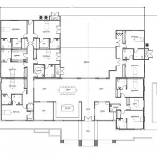 A detailed architectural floor plan showing the layout of multiple rooms in a building.