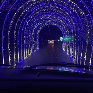 Driving through a mesmerizing blue light tunnel.