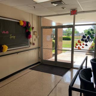 A welcoming school entrance adorned with colorful decorations.