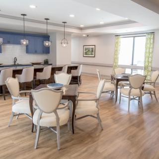 A modern dining area with elegant furniture and stylish lighting.
