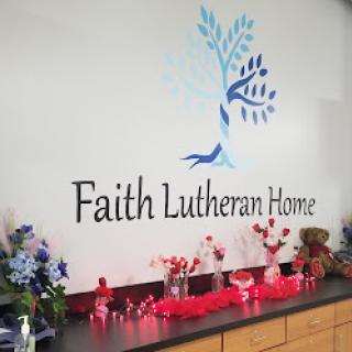 A beautifully decorated space at Faith Lutheran Home, featuring artistic wall design and vibrant floral arrangements.