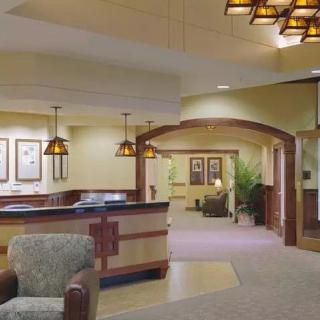 A well-lit lobby and reception area with comfortable seating and modern decor.