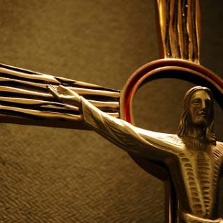 A close-up view of a stylized crucifix, symbolizing the Christian faith.