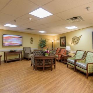A well-furnished waiting room with comfortable seating and elegant decor.