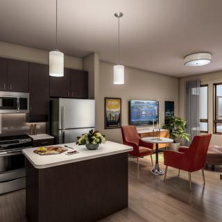 A modern open-plan kitchen and living area featuring stylish furniture and contemporary appliances.