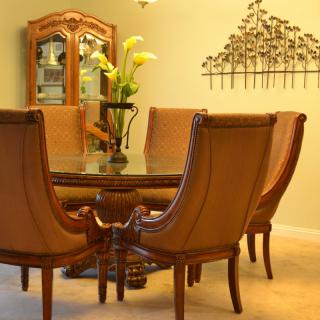 A well-arranged dining room with a stylish table set and elegant decor.