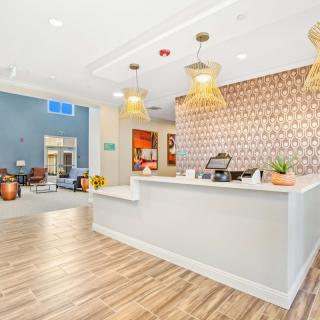 A modern reception area with decorative lighting and a welcoming desk.