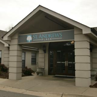 Front view of a healthcare office building with clear signage.