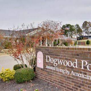 Entrance sign for Dogwood Pet, surrounded by landscaped greenery.
