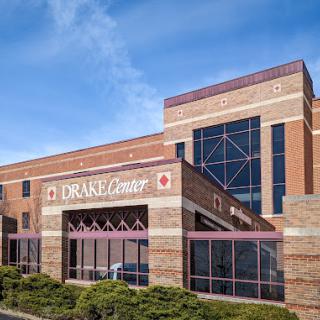 The Drane Center, a modern healthcare facility featuring brick architecture and large windows.