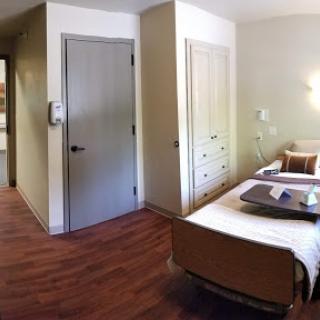 A view of a well-designed patient room in a healthcare facility.