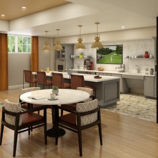 A modern and spacious kitchen with an open dining area, featuring an island and stylish lighting.